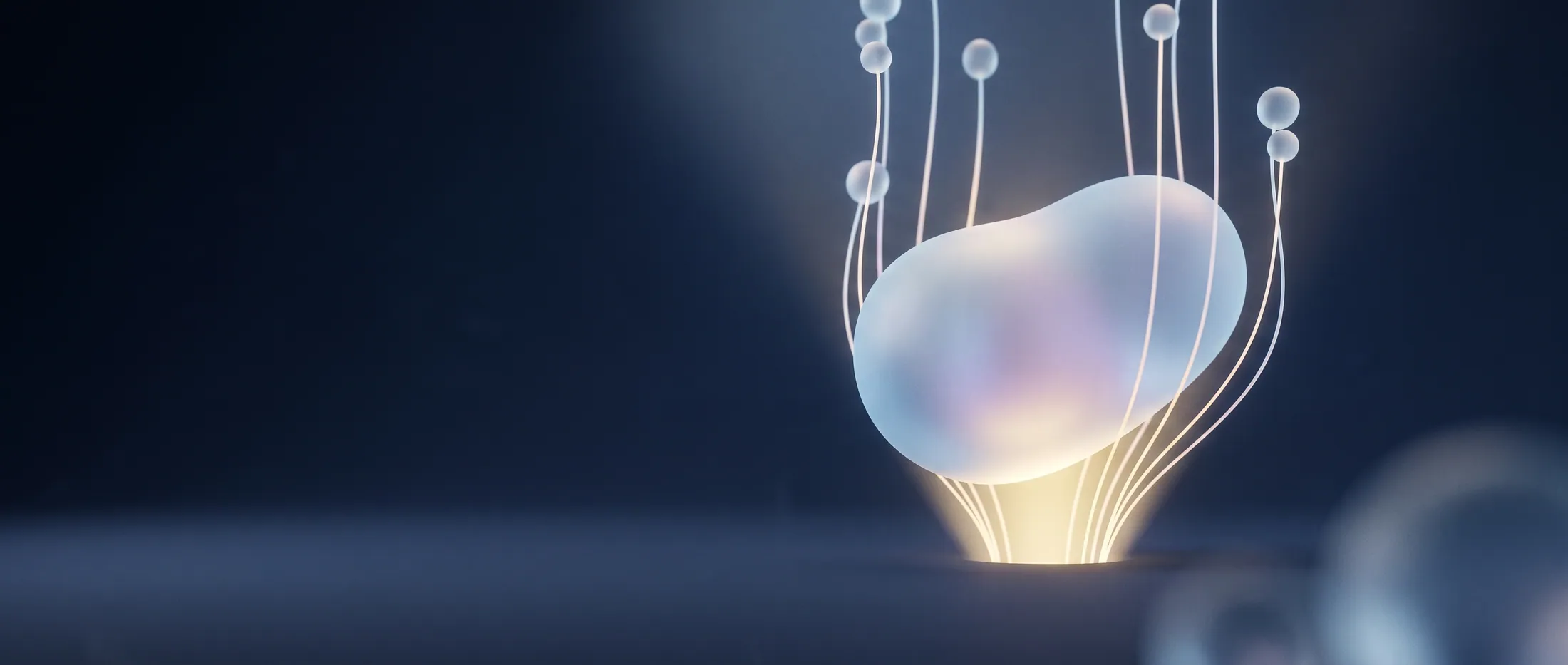 A single frosted-glass lobe lifted by a warm beam of light, with glowing threads rising around it